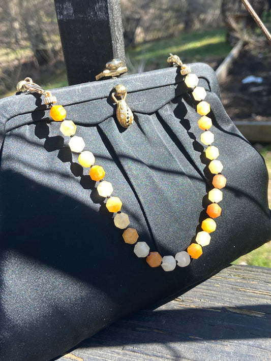 Yellow faceted jade purse